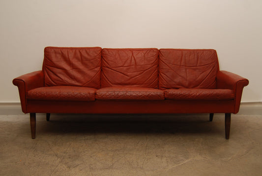 Red leather three seater