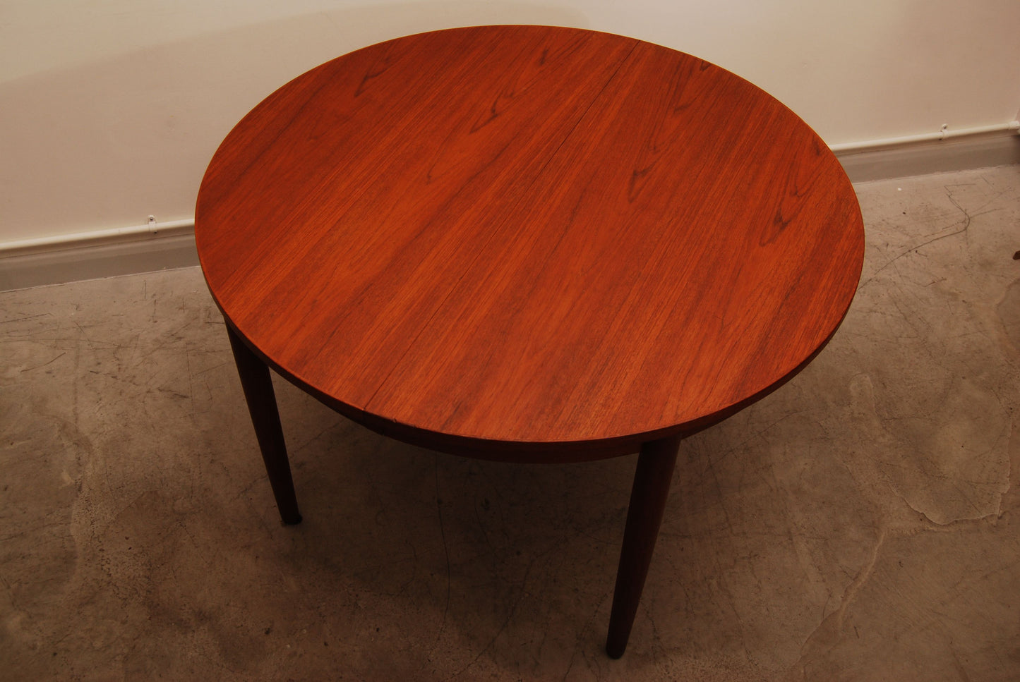 Extending teak dining table