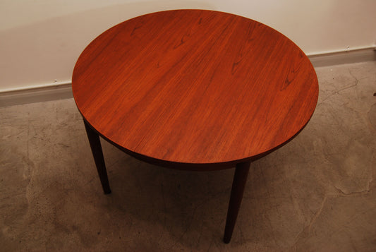 Extending teak dining table