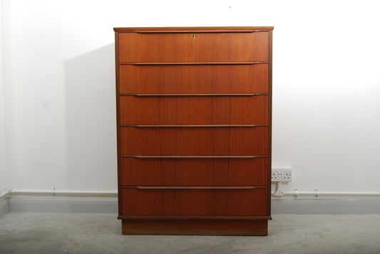 Tall teak chest of six drawers
