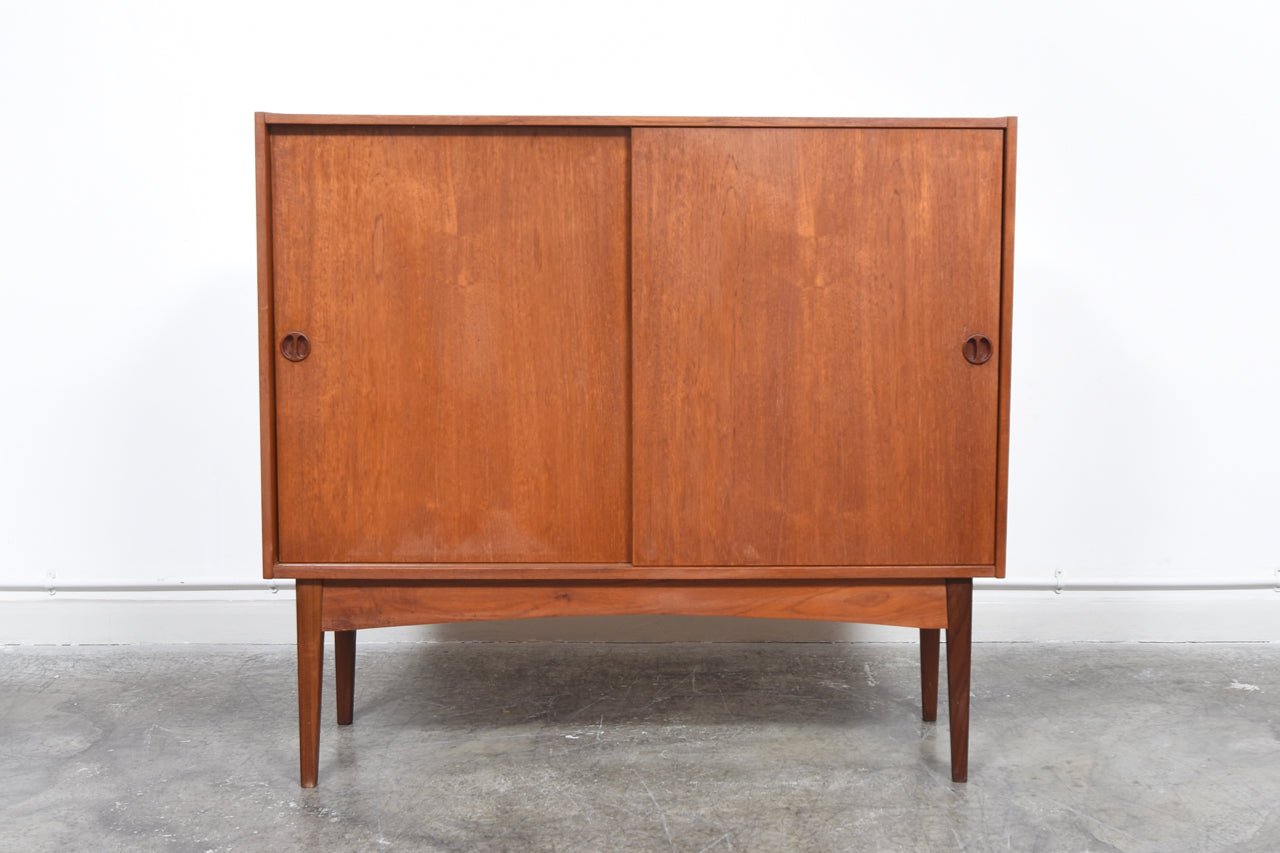 1960s teak storage cabinet with sliding doors