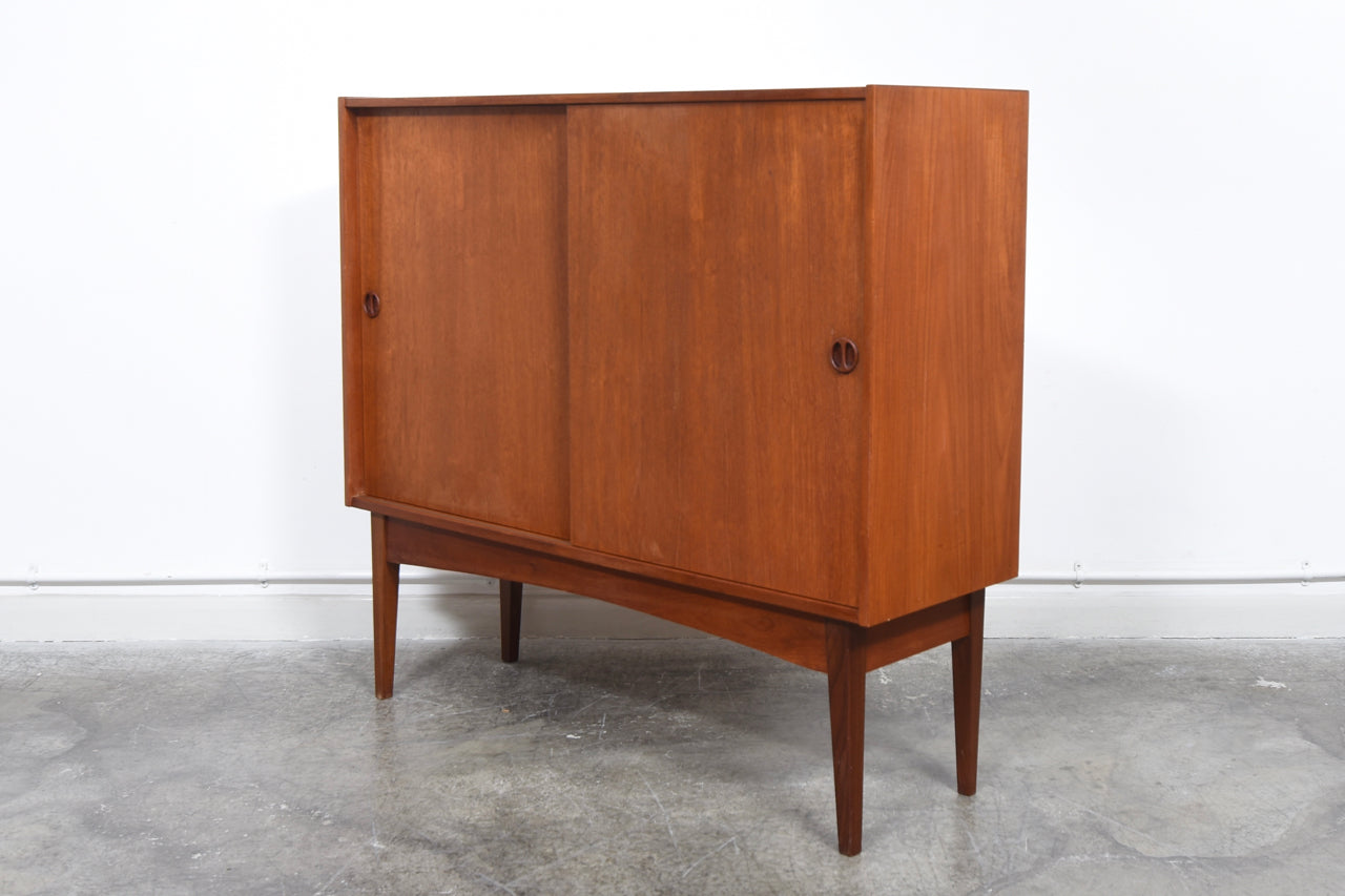 1960s teak storage cabinet with sliding doors