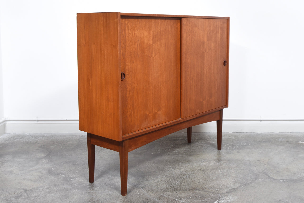 1960s teak storage cabinet with sliding doors