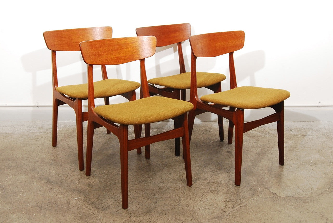 Set of four teak dining chairs