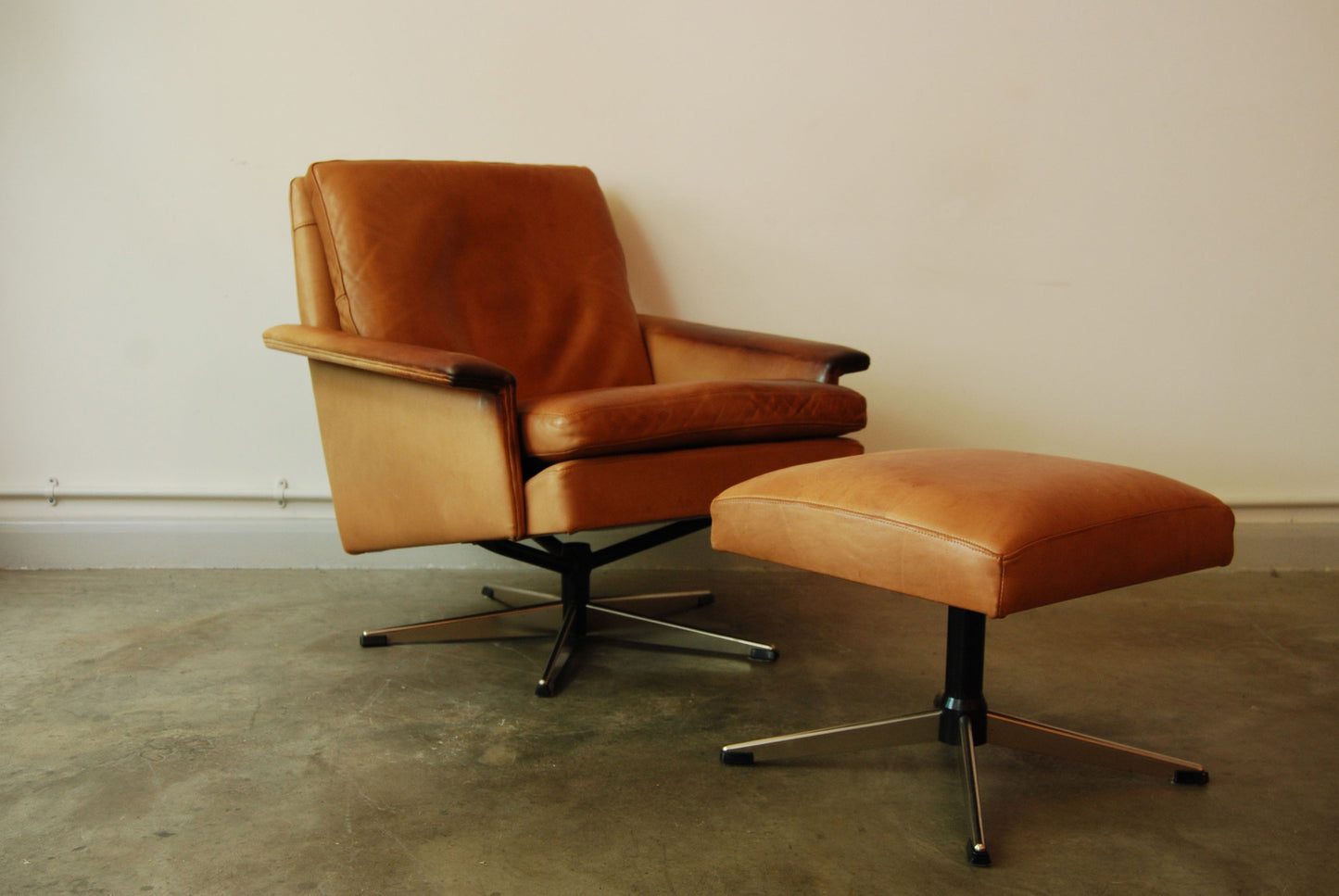 Leather lounge chair with matching footstool