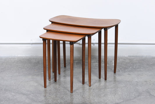 Nest of three teak tables