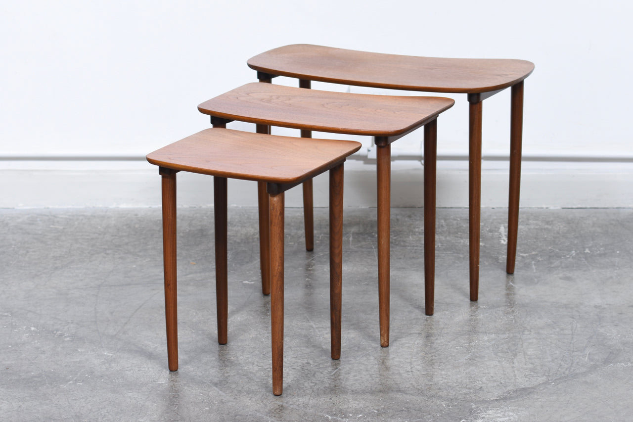 Nest of three teak tables