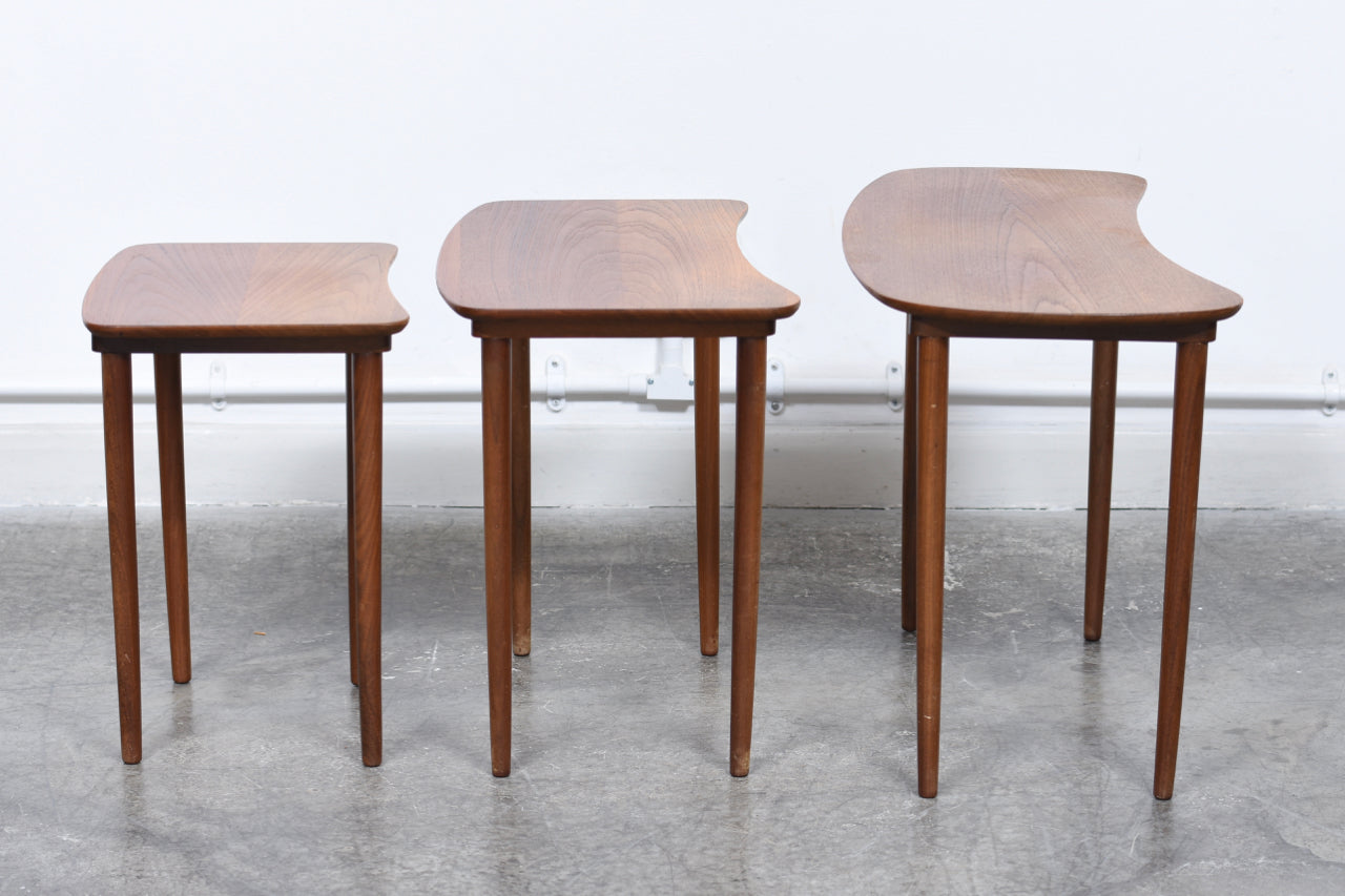 Nest of three teak tables