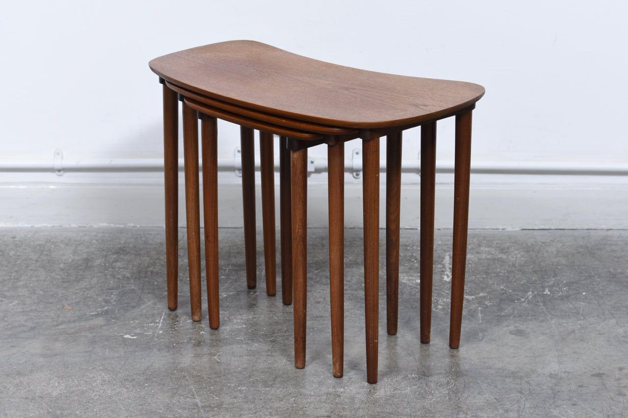 Nest of three teak tables