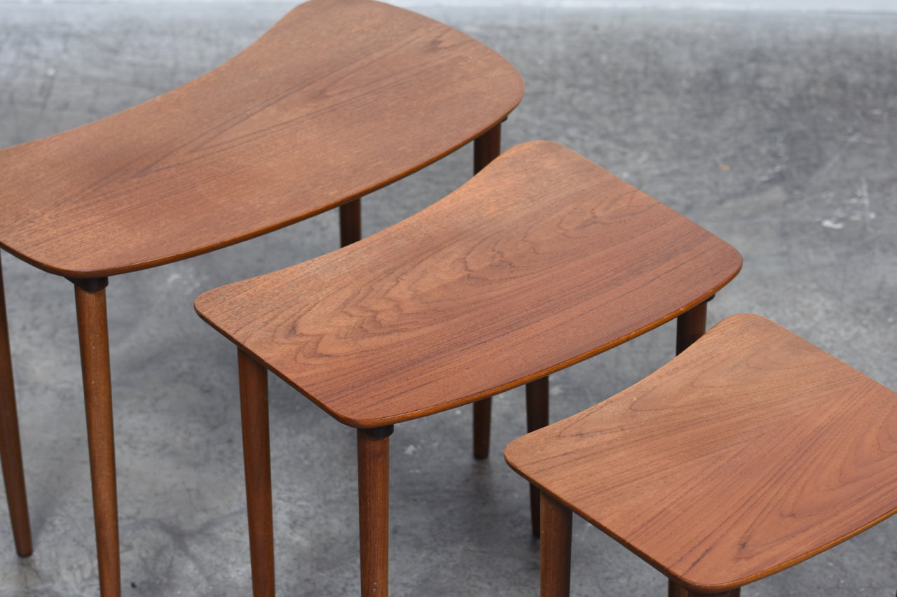 Nest of three teak tables