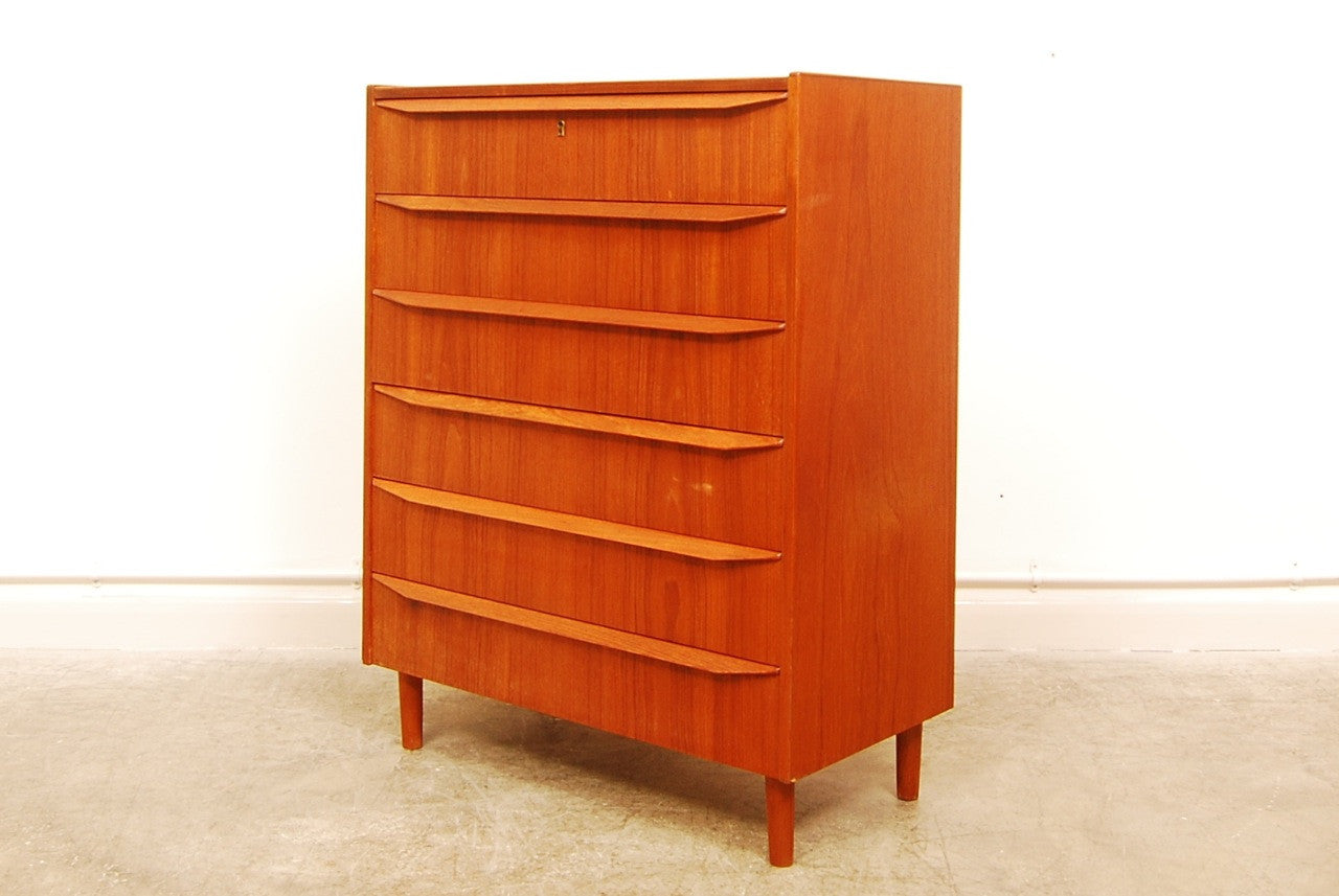 Teak chest of six drawers with lipped handles