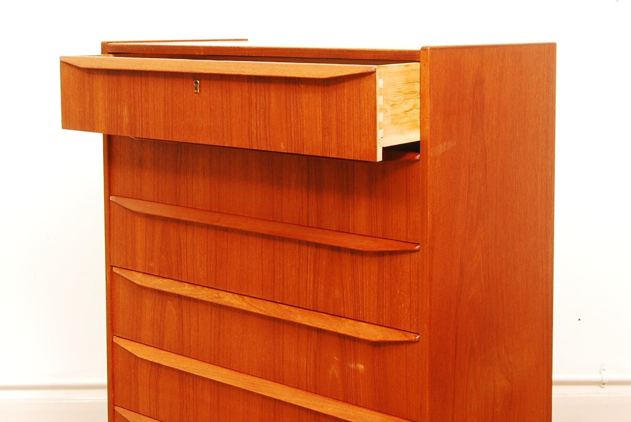 Teak chest of six drawers with lipped handles