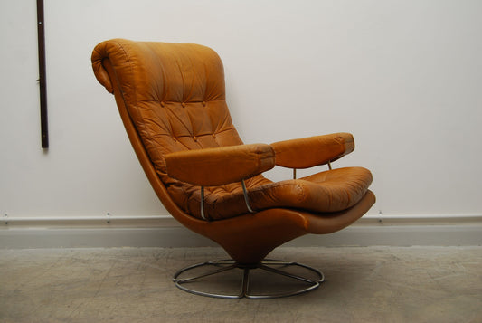 Caramel leather lounger on swivel base