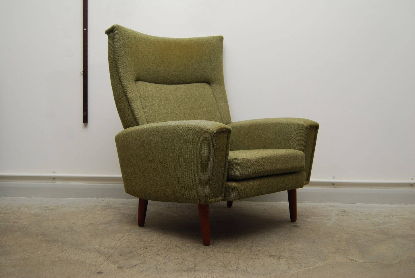 Highback lounge chair in tweed