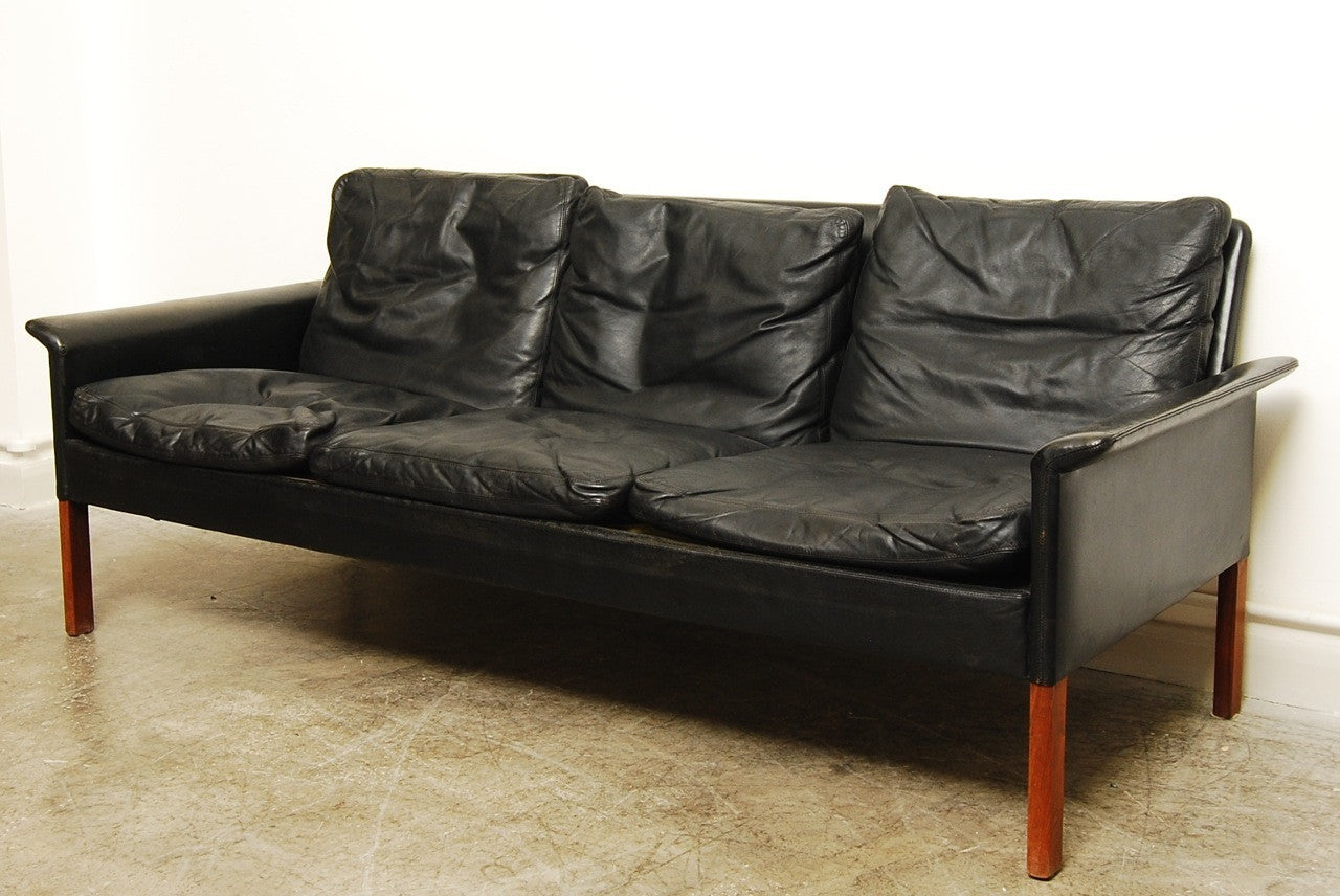 Three seat leather sofa by Hans Olsen