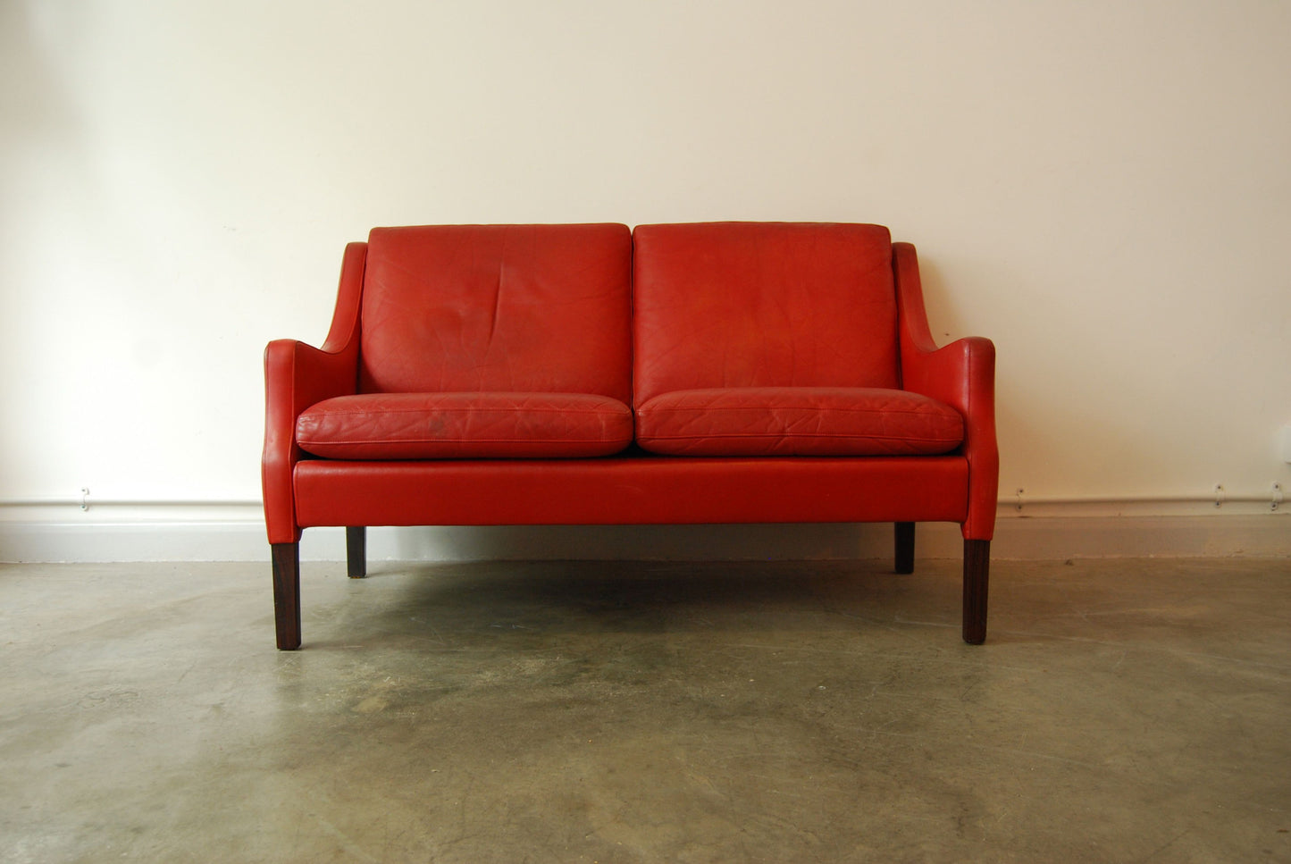 Two seat sofa in red leather