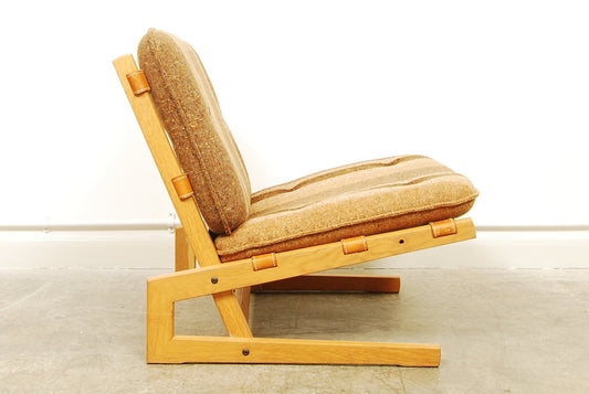 Low oak lounge chair