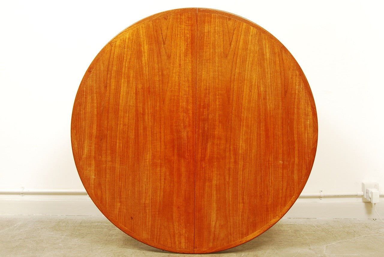 Round teak dining table