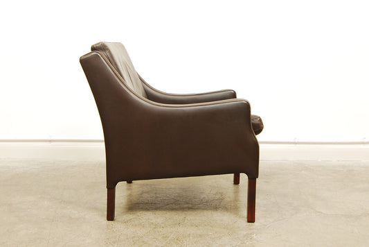 Brown leather club chair