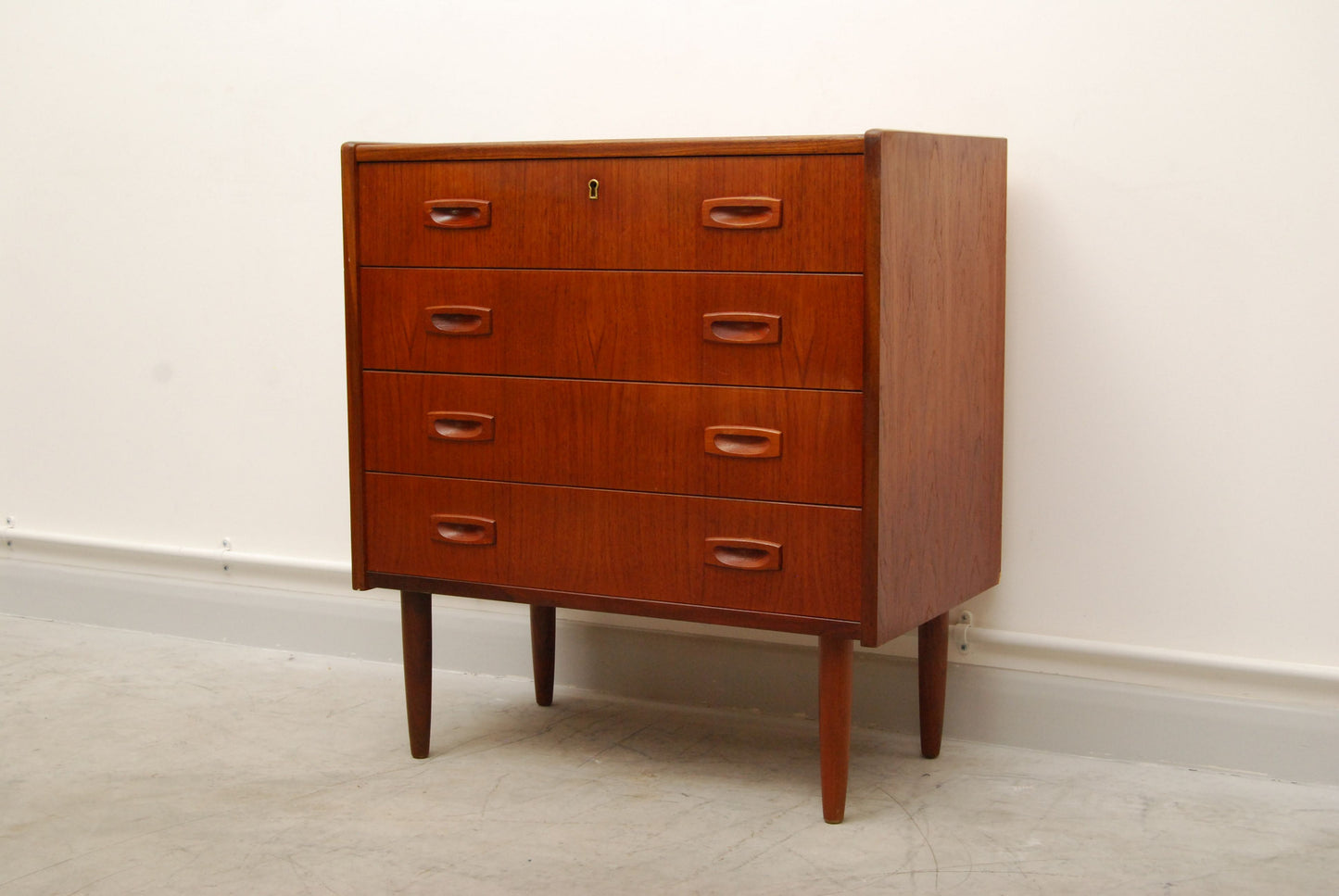 Short chest of four drawers with inset handles