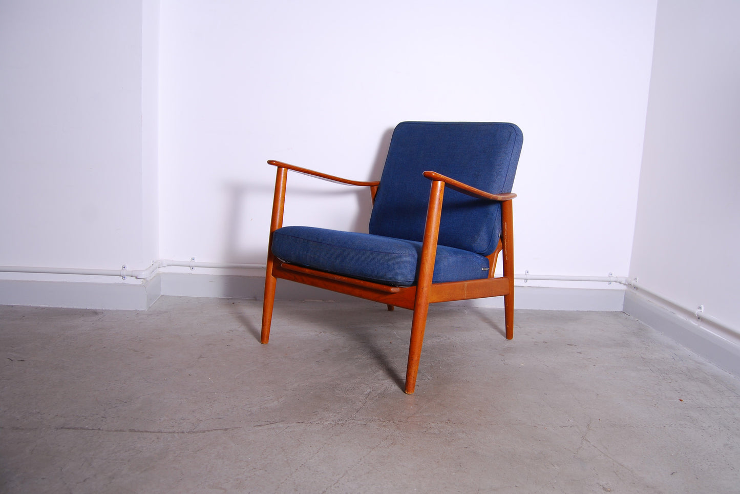 Teak lounge chair with royal blue cushions