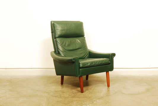 High back green leather lounge chair