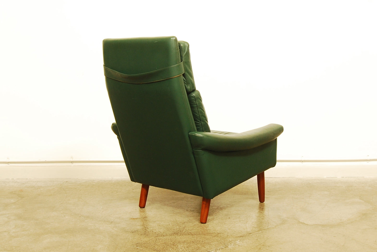 High back green leather lounge chair