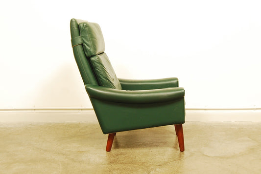 High back green leather lounge chair