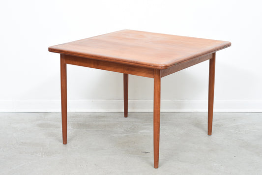 Extending square dining table in teak