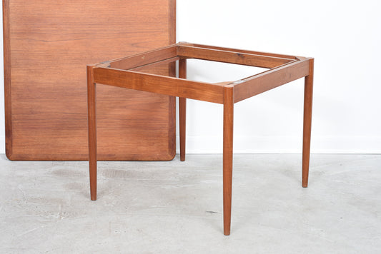 Extending square dining table in teak