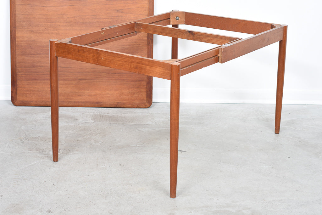 Extending square dining table in teak