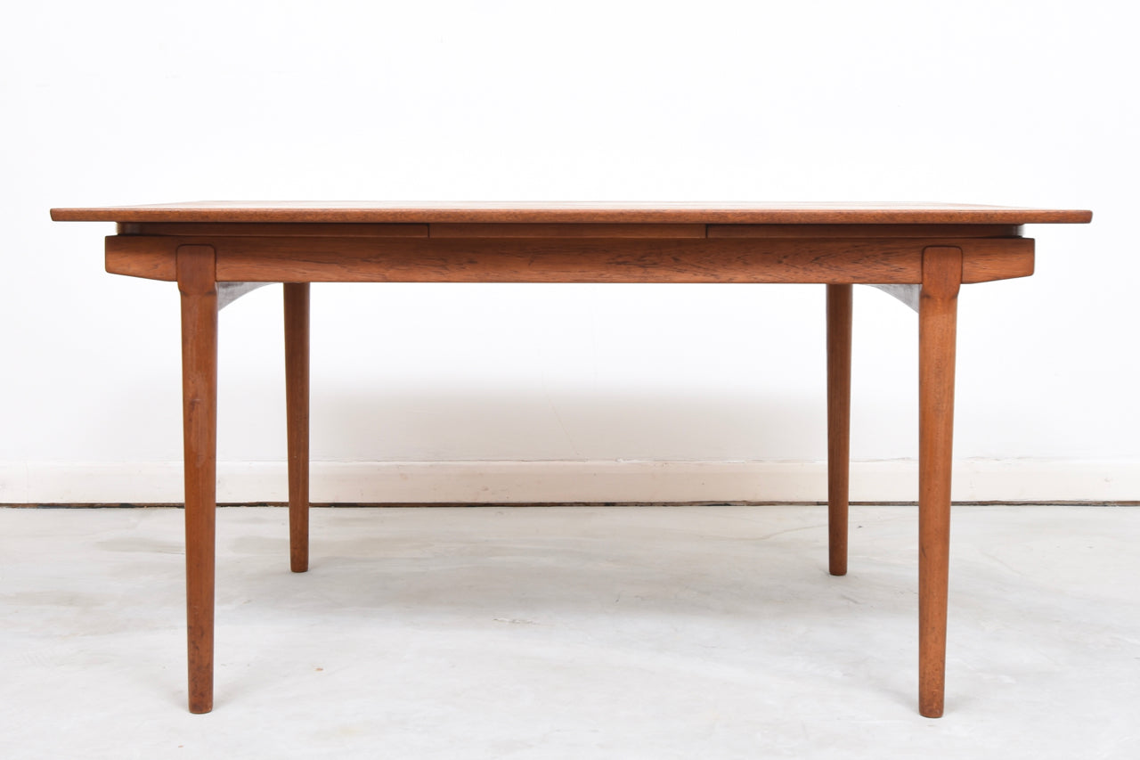 Extending teak dining table by Vamo