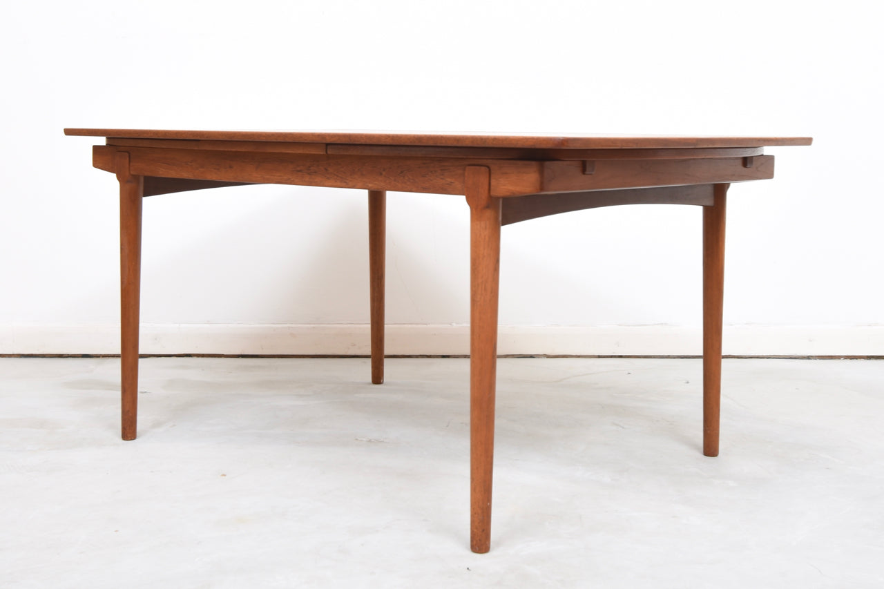 Extending teak dining table by Vamo