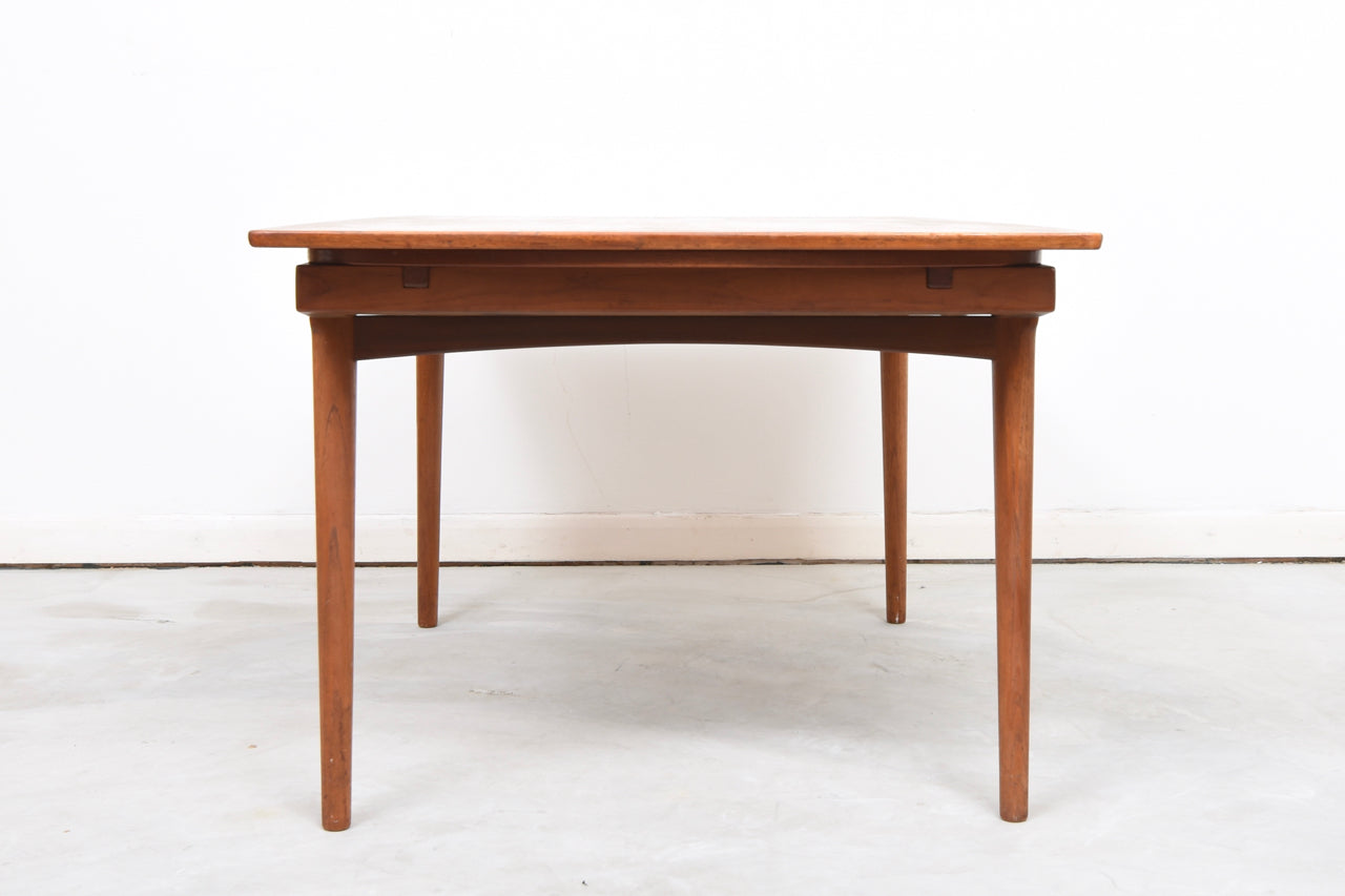 Extending teak dining table by Vamo