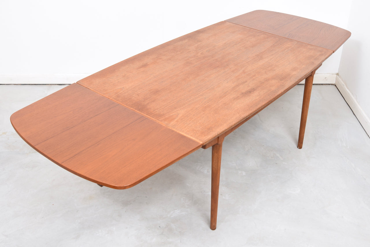 Extending teak dining table by Vamo