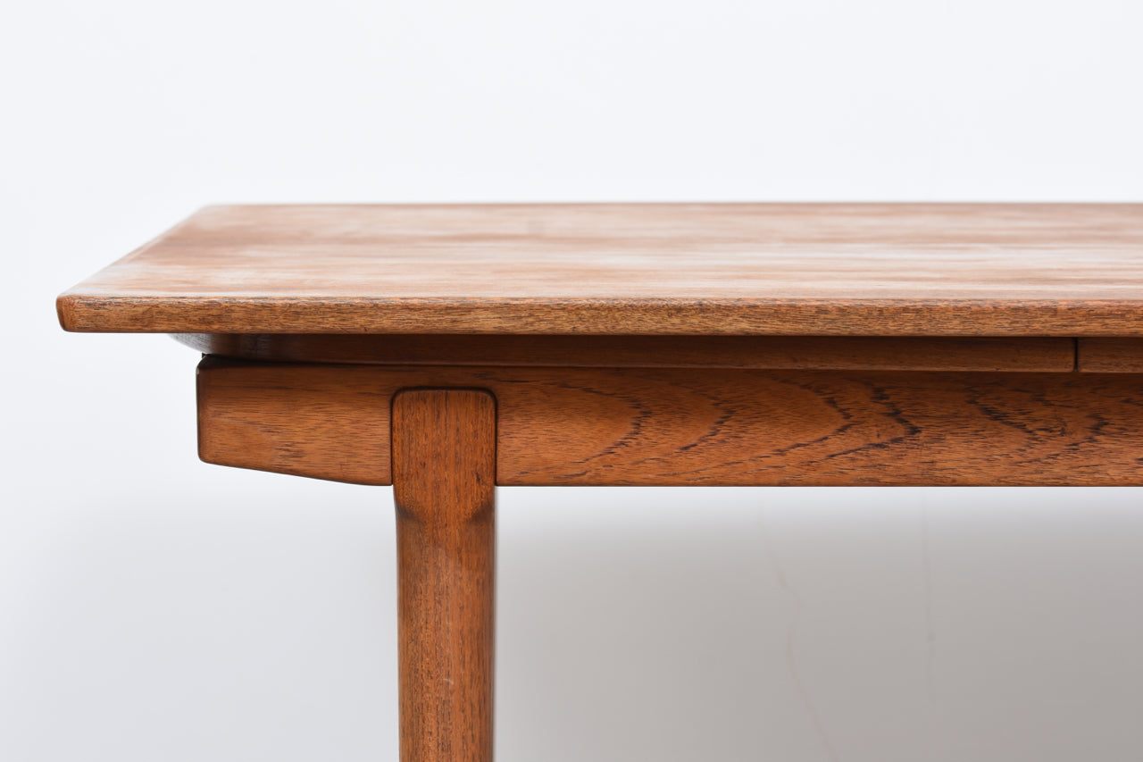 Extending teak dining table by Vamo