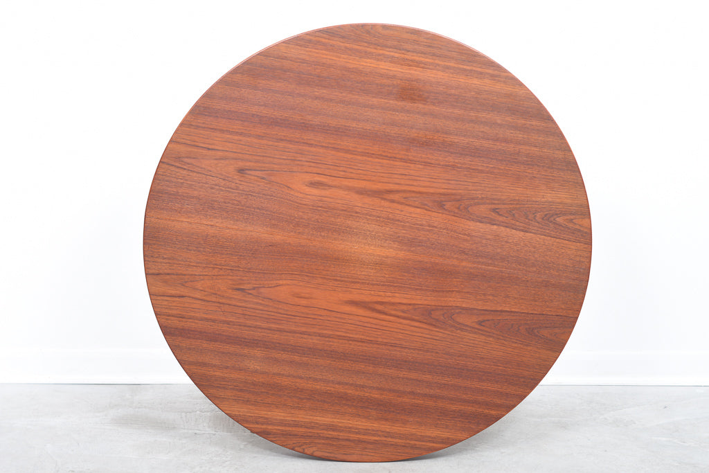 Extending round dining table in teak