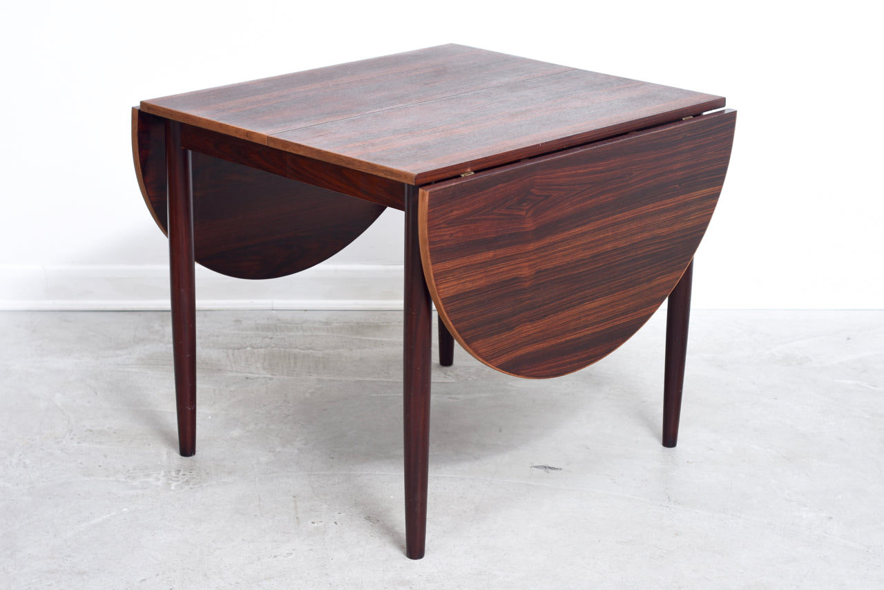 Extending dining table in rosewood