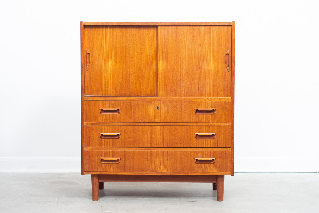 Low teak storage cabinet