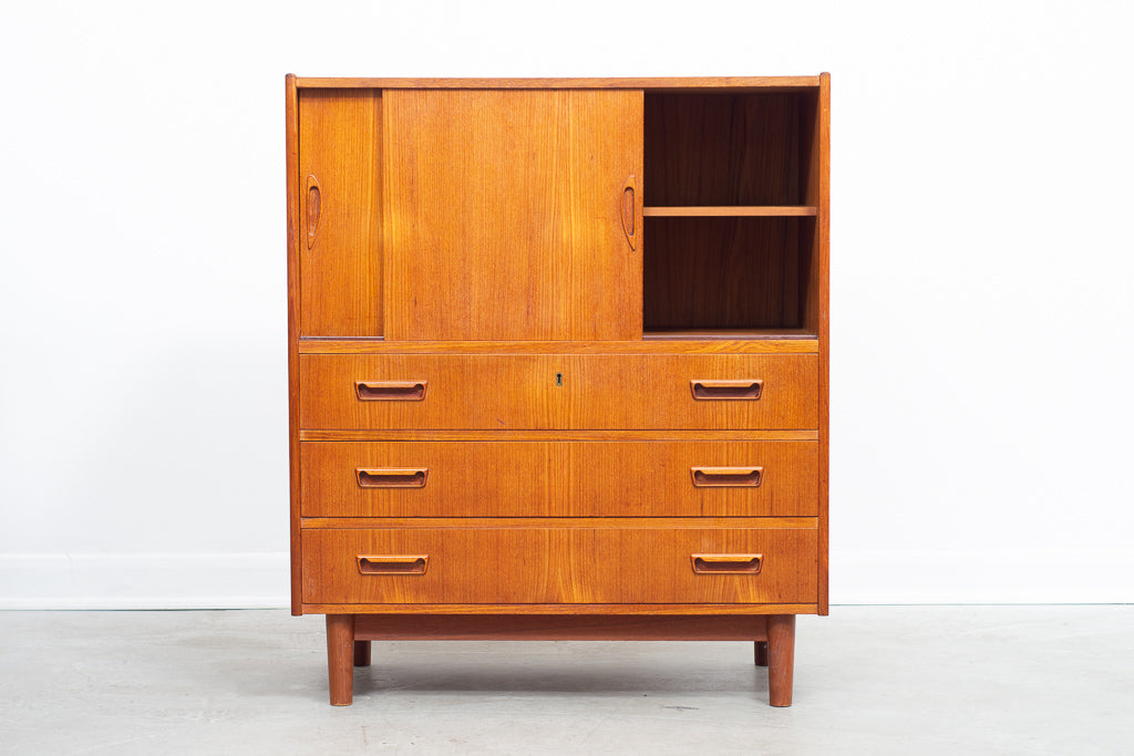 Low teak storage cabinet