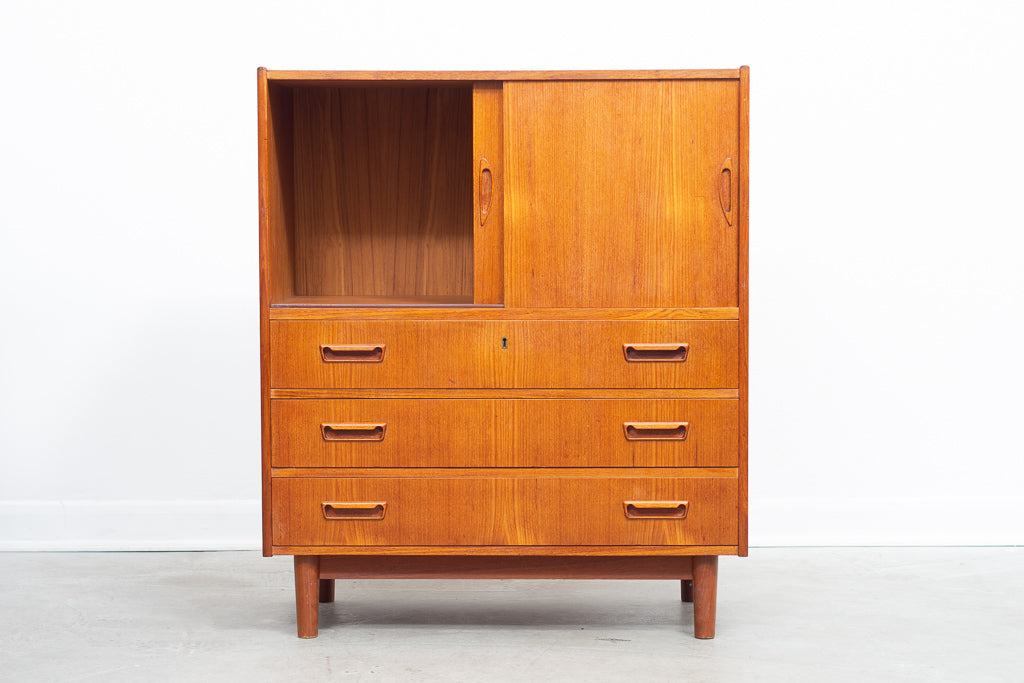 Low teak storage cabinet