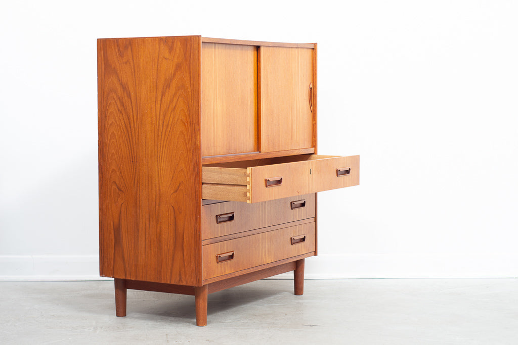 Low teak storage cabinet