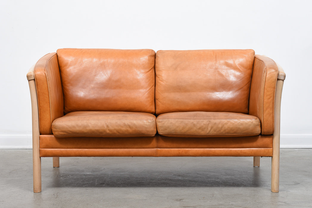 Two seat leather sofa by Stouby