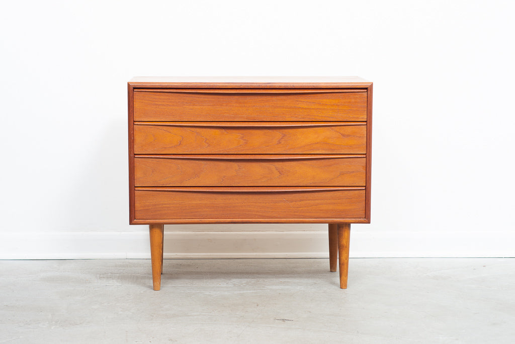 Low chest of teak drawers