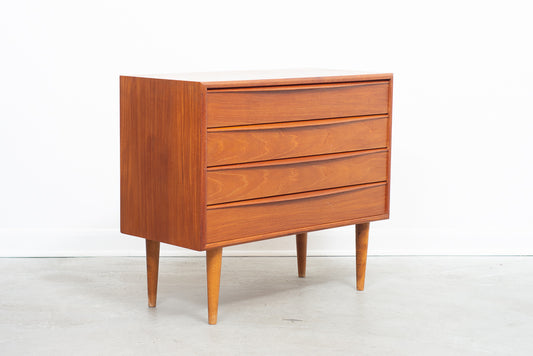 Low chest of teak drawers