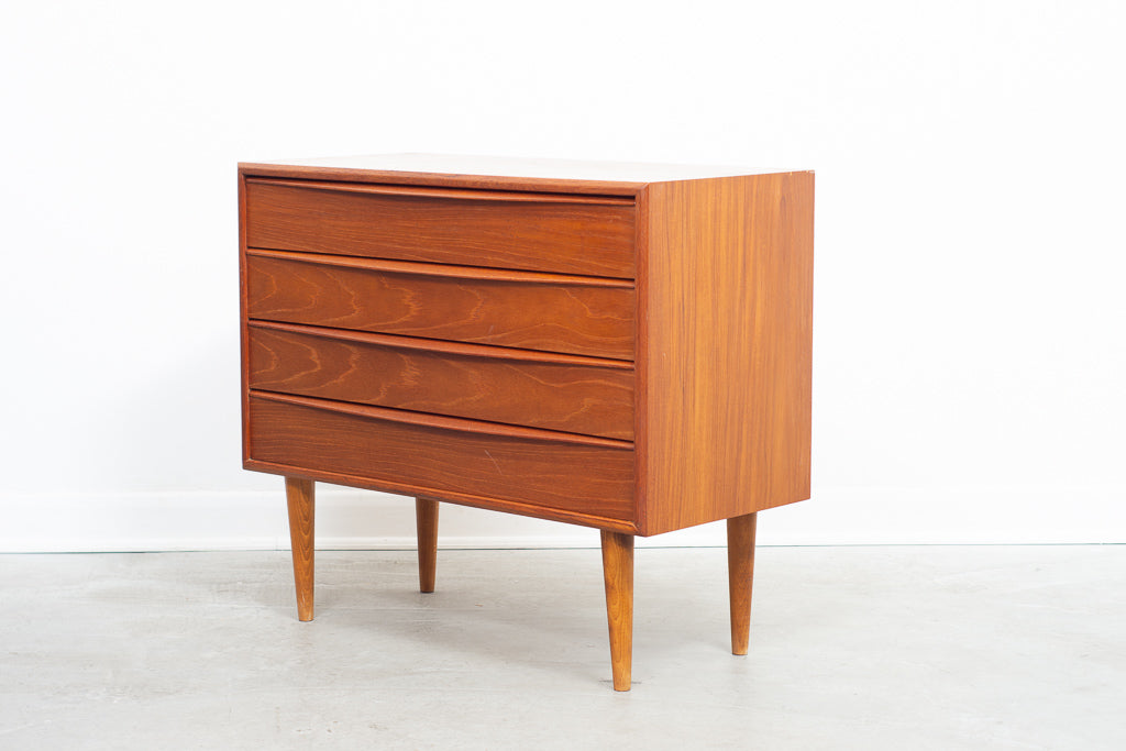 Low chest of teak drawers