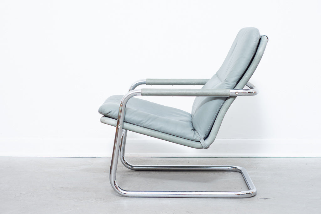 Leather + steel lounger by DUX