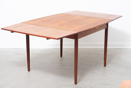 Extending square dining table in teak