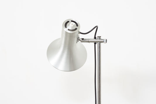 Twin-headed floor lamp with metallic finish