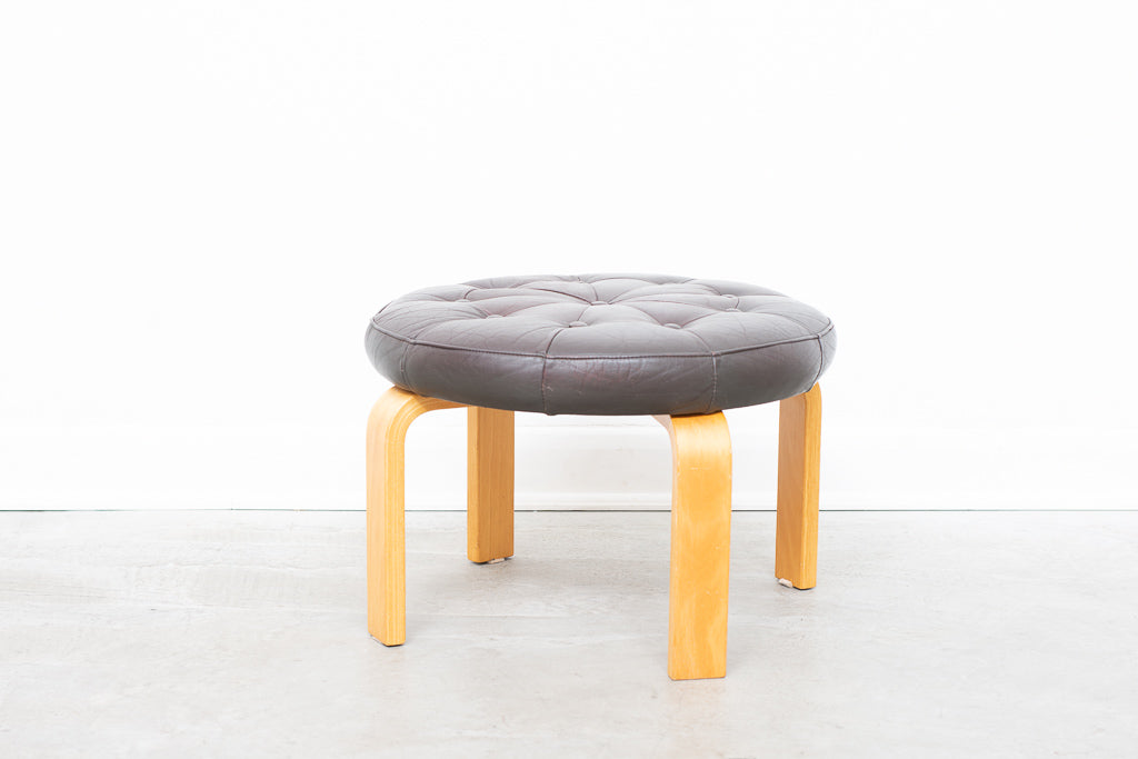 Leather foot stool with beech ply legs